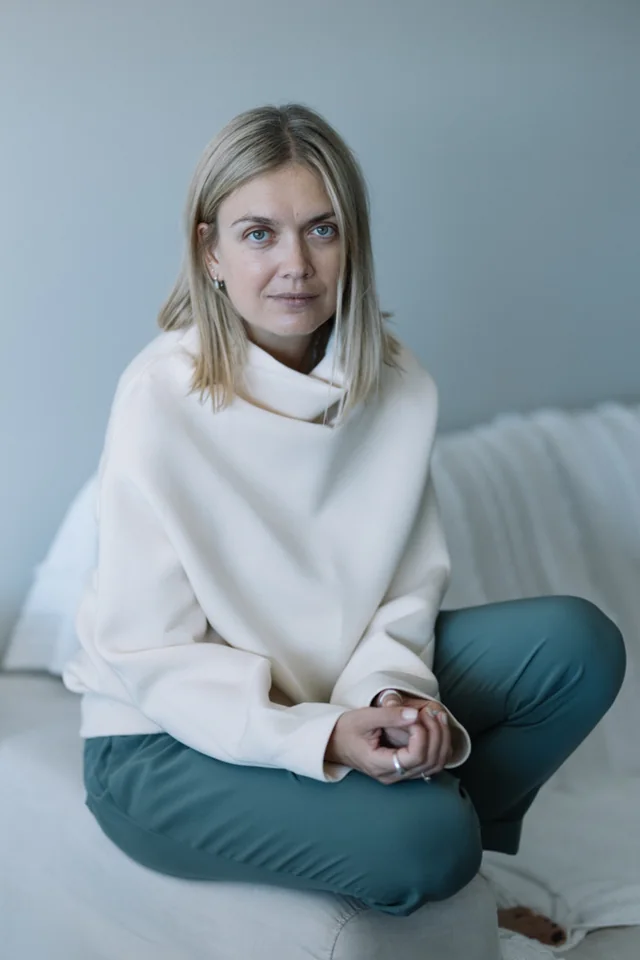 Tanya Ryasnykh seated in a white jacket